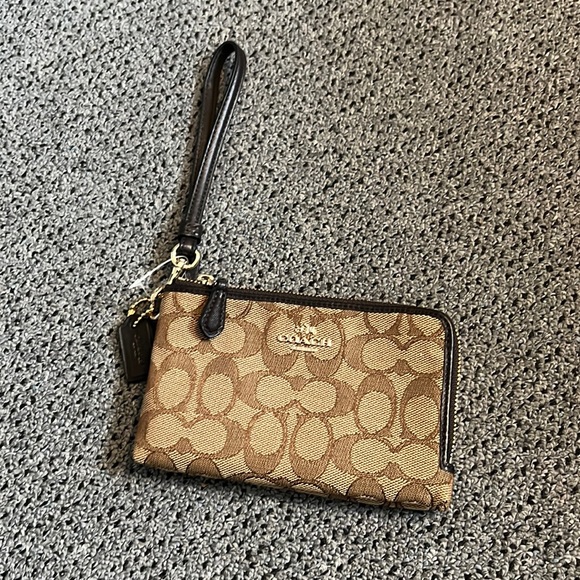 Never used wristlet by Coach. Brown. - Picture 1 of 4